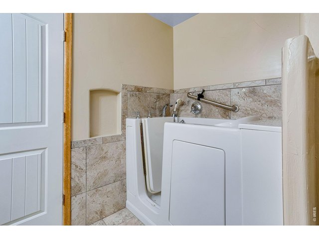 Property Photo 31 Walk-in Tub with hand bar