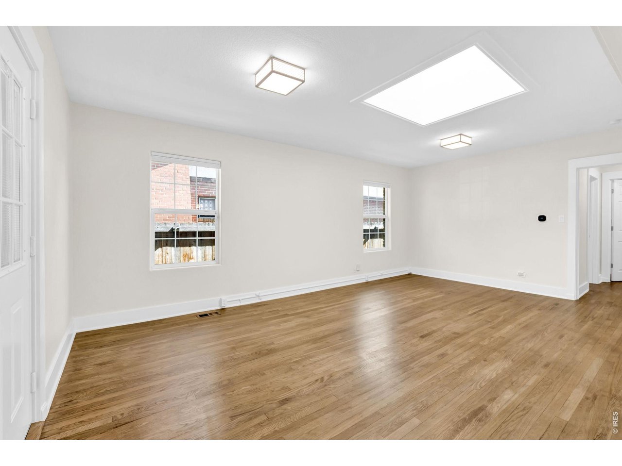 Property Photo 15 Spacious living room with Skylight.
