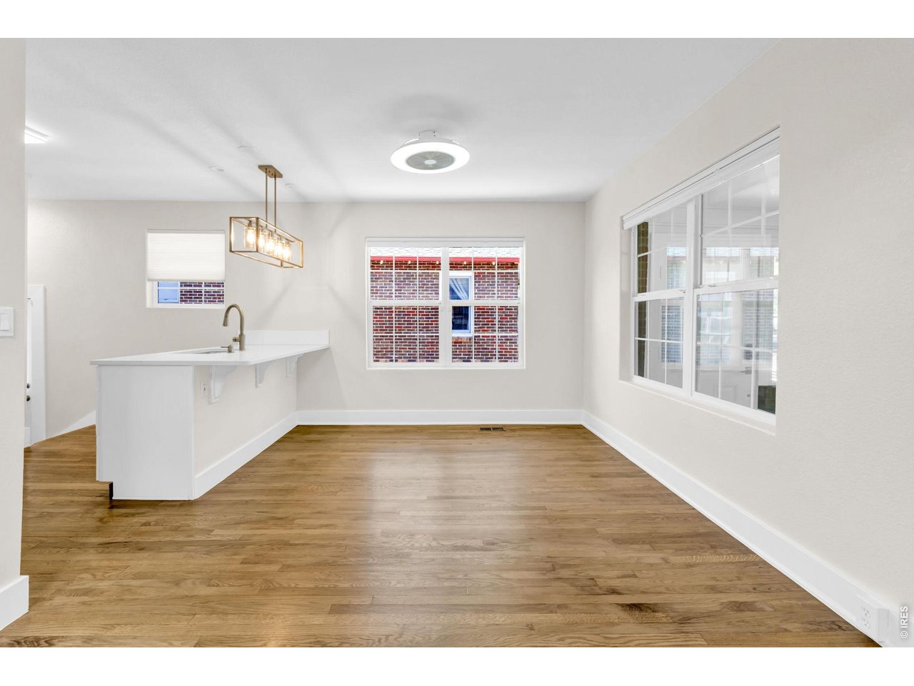 Property Photo 7 Refinished hardwood floors throughout the main floor.