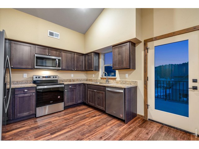 Property Photo 5 Granite countertops and LVP.