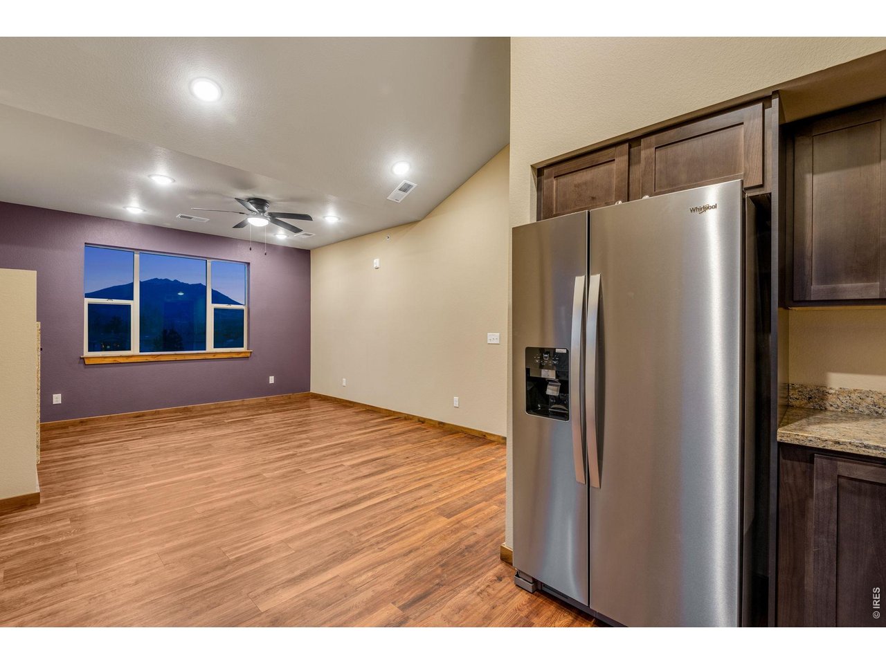 Property Photo 8 Large picture window in living room with beautiful views!