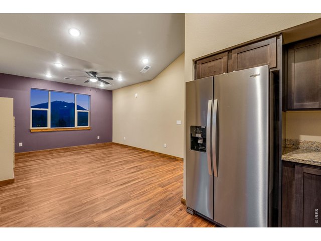 Property Photo 8 Large picture window in living room with beautiful views!