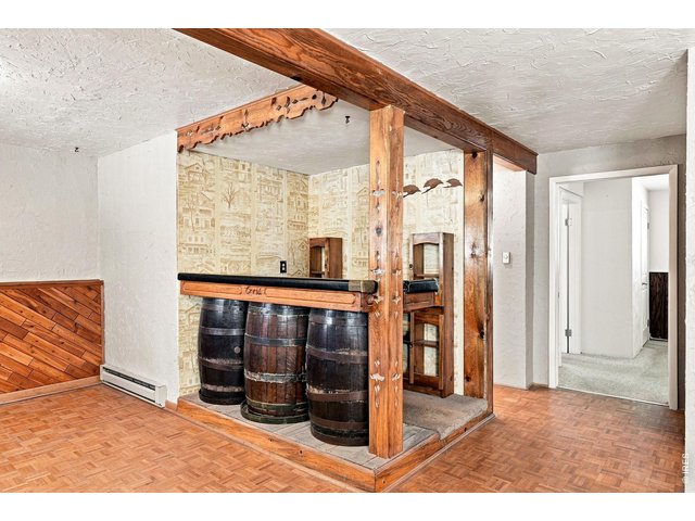 Property Photo 31 Family Room with fireplace and bar area