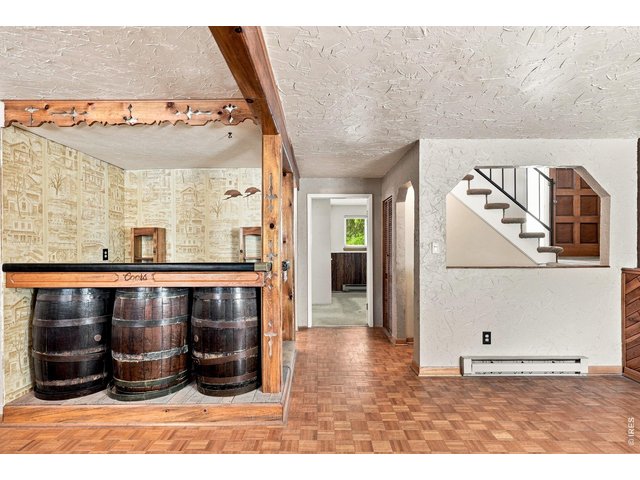 Property Photo 33 Family Room with fireplace and bar area