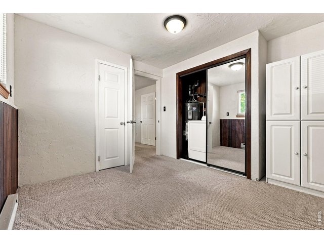Property Photo 36 Lower Level Bedroom and Laundry Area