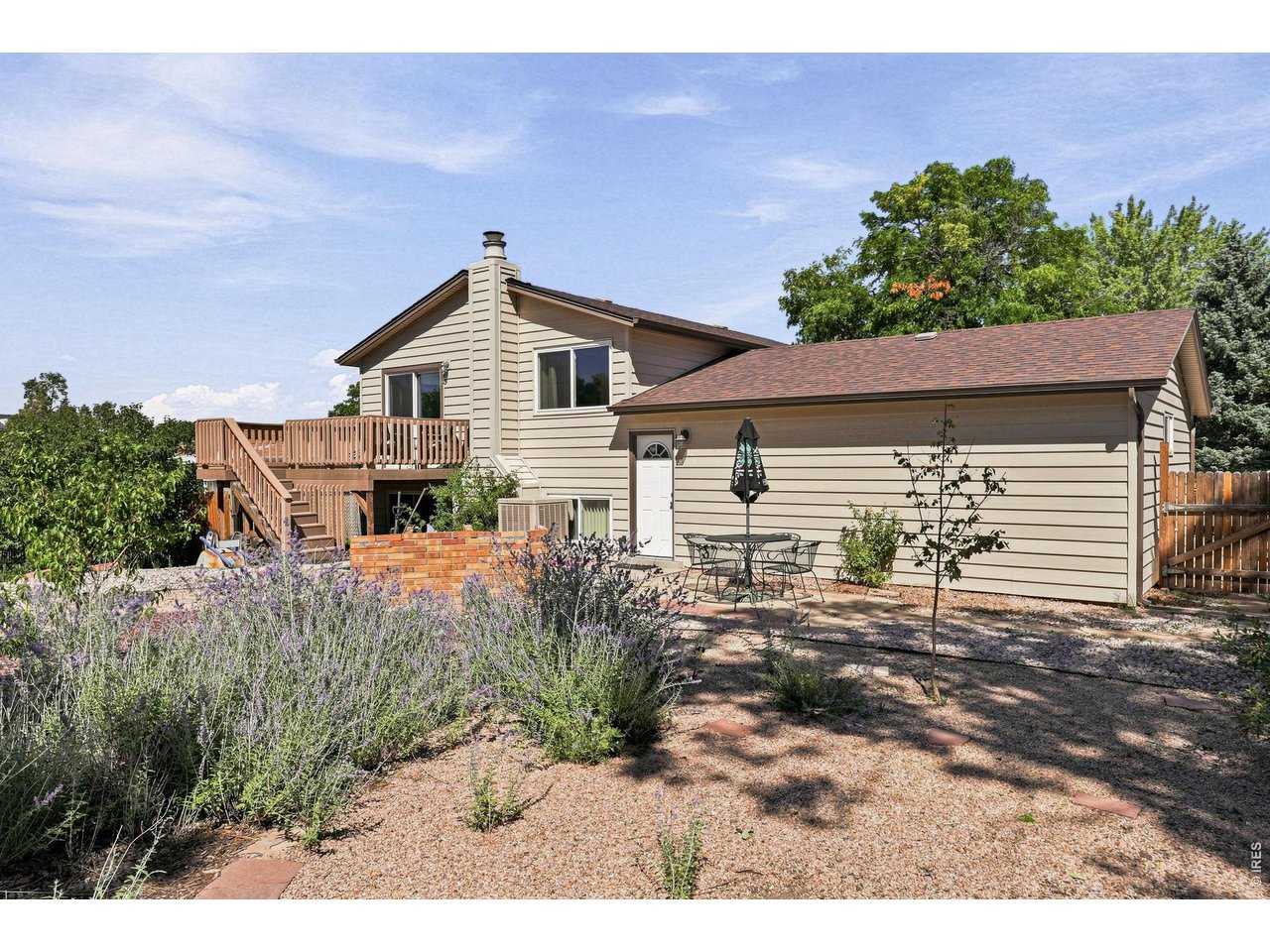 Property Photo 40 Expansive backyard features a Trex deck, patio, fruit trees, and grapevines, providing plenty of room for outdoor enjoyment and gardening