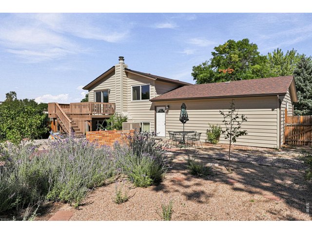 Property Photo 40 Expansive backyard features a Trex deck, patio, fruit trees, and grapevines, providing plenty of room for outdoor enjoyment and gardening