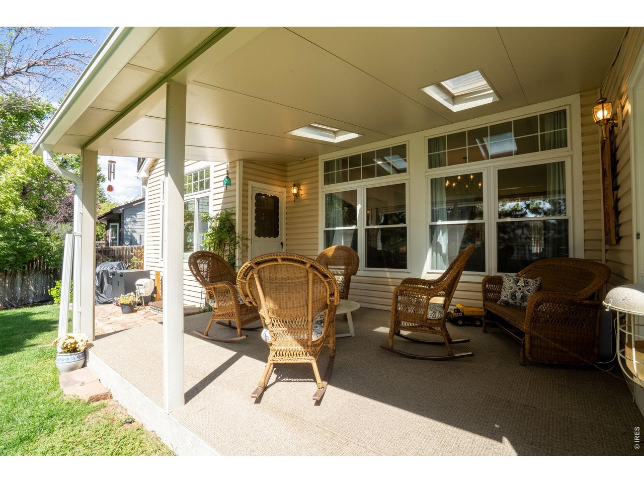 Property Photo 38 Covered patio with new flooring, skylights