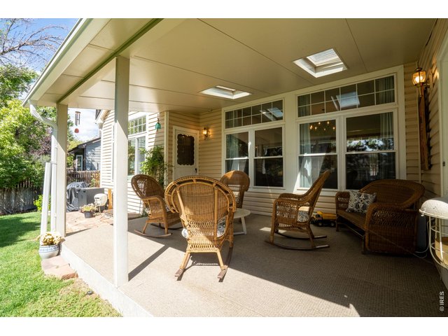 Property Photo 38 Covered patio with new flooring, skylights
