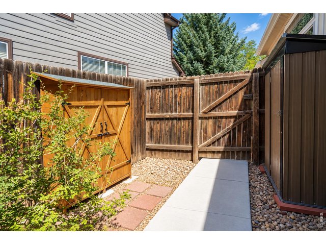 Property Photo 42 Gates on both sides of yard with storage options.