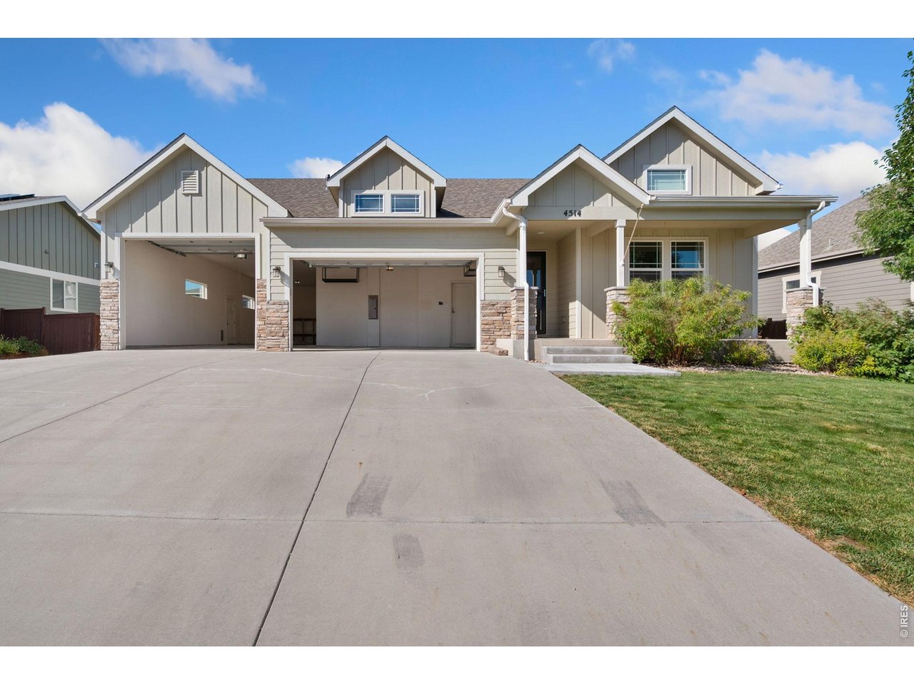 Property Photo 3 1176 Sq Ft Four Car Garage, with easy to use Heater during cooler temps! Bring your toys and hobbies!