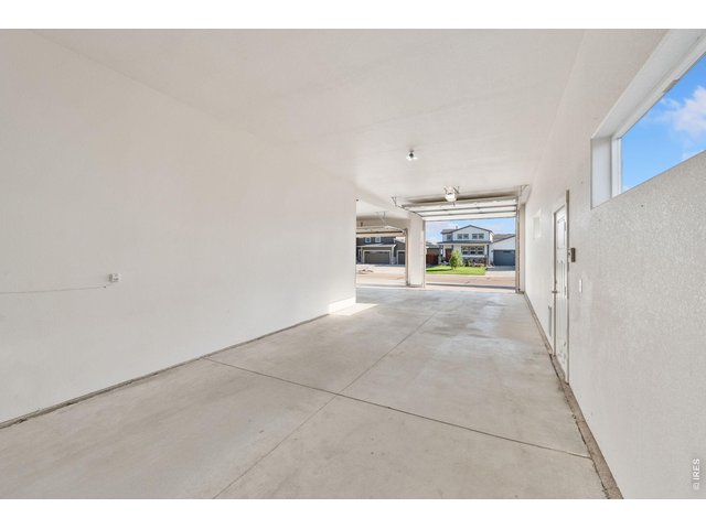 Property Photo 4 Tandem third and four car garage. Door opening is 9'8".