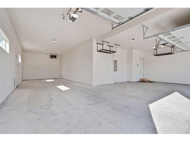 Property Photo 29 1176 Sq Ft Garage with a door that leads to the backyard.