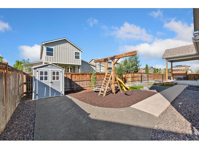 Property Photo 32 Xeriscaped backyard with shed.