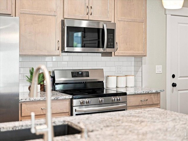 Property Photo 12 Designer finishes and stainless appliances