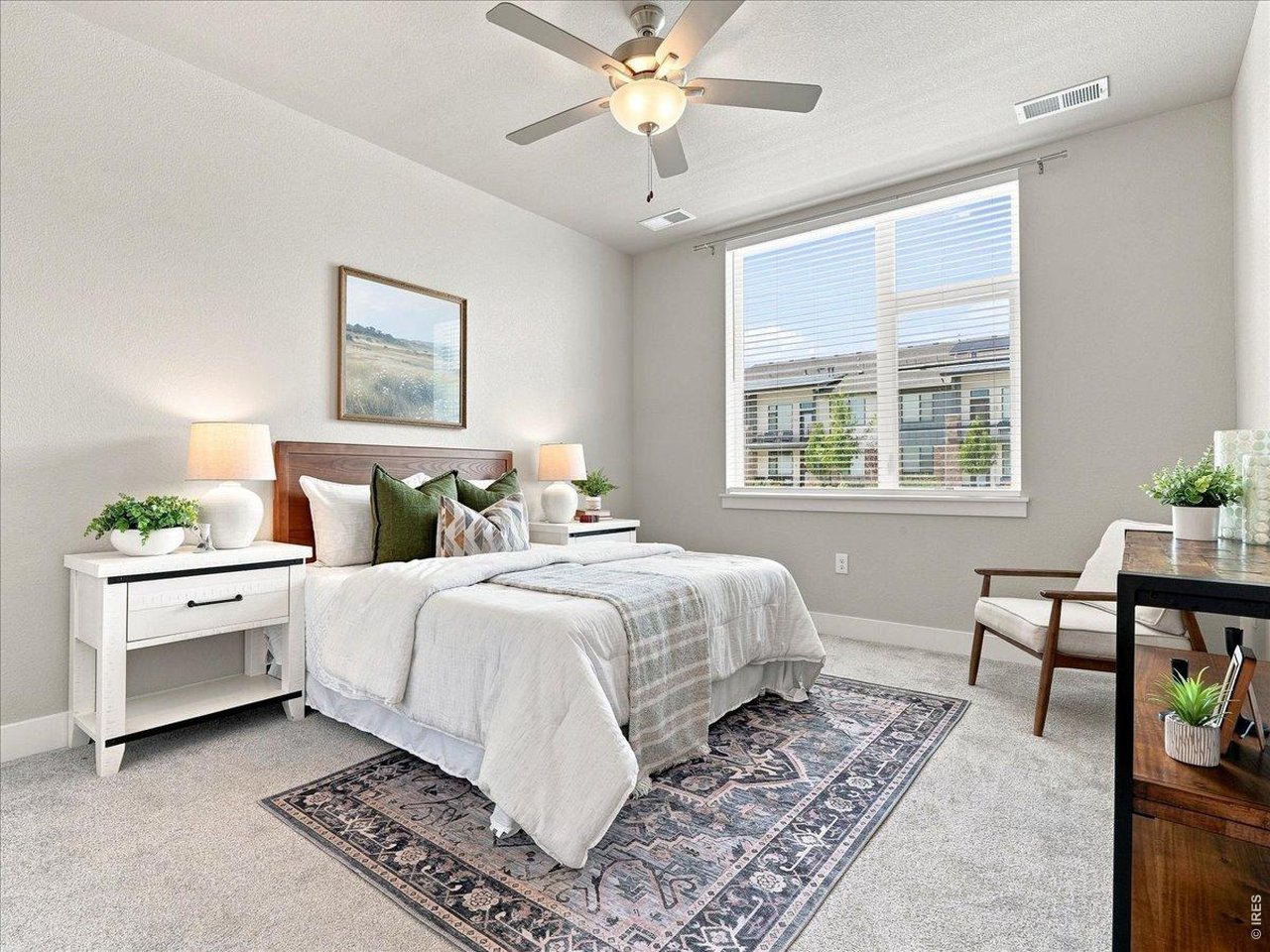 Property Photo 21 Primary bedroom is loaded with natural light and cozy carpeting