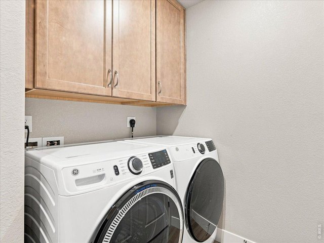 Property Photo 26 Laundry just off the kitchen with new cabinets for additional storage