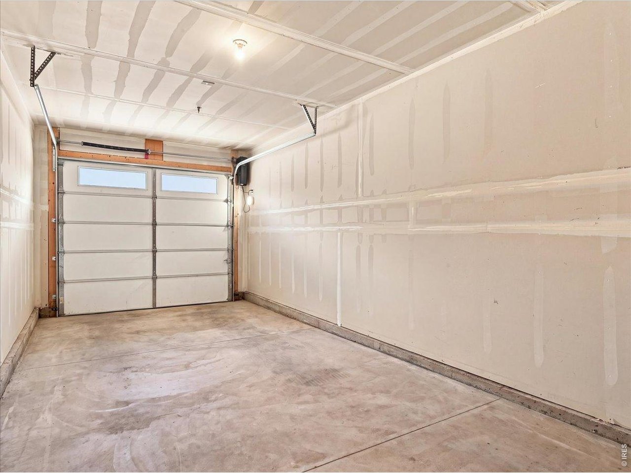 Property Photo 29 Oversized garage with smart garage door opener and you don't have to take a step outside to access this space!