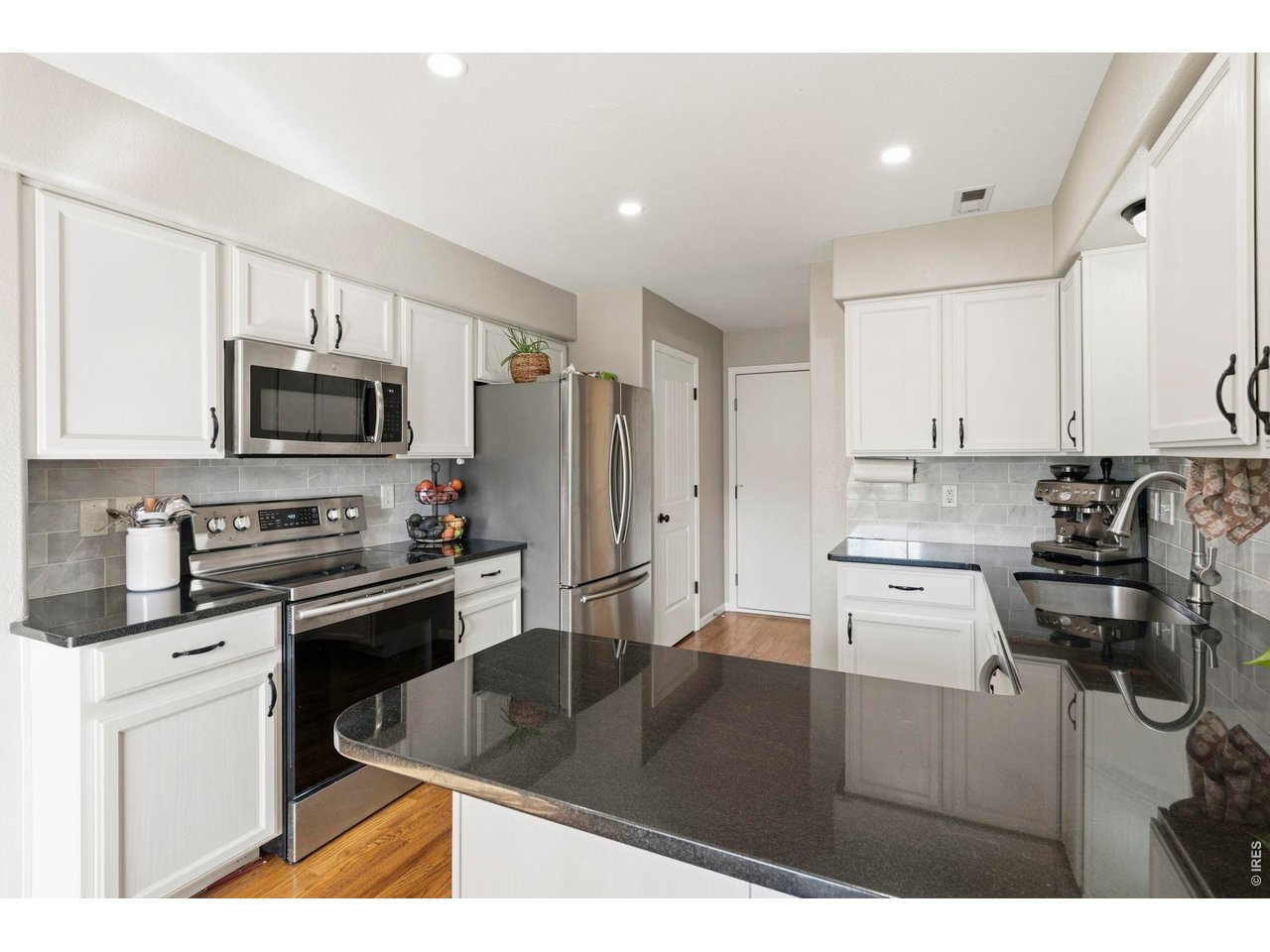 Property Photo 11 Chef's kitchen with single basin sink.