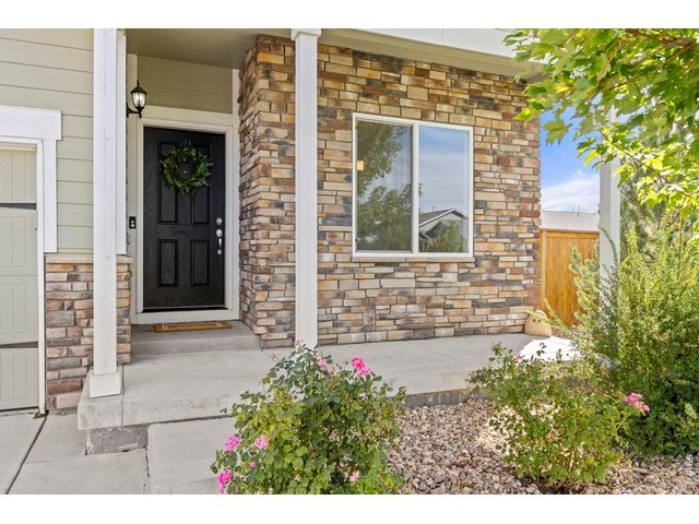 Property Photo 4 Front Patio with Mature Landscaping