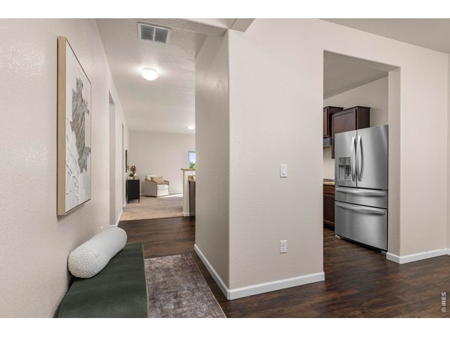 Property Photo 6 Entryway with Access to Kitchen & Separate Dining Area