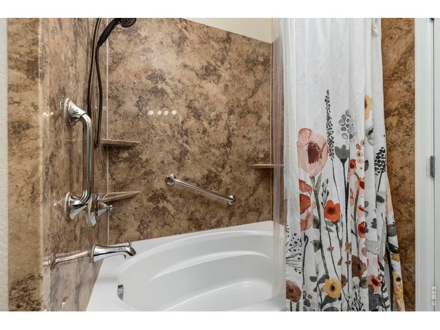 Property Photo 17 Upgraded Shower with Mohen Wynford Fixtures, Santa Cruz Wall Surrounds, & BCI Acrylic Tub