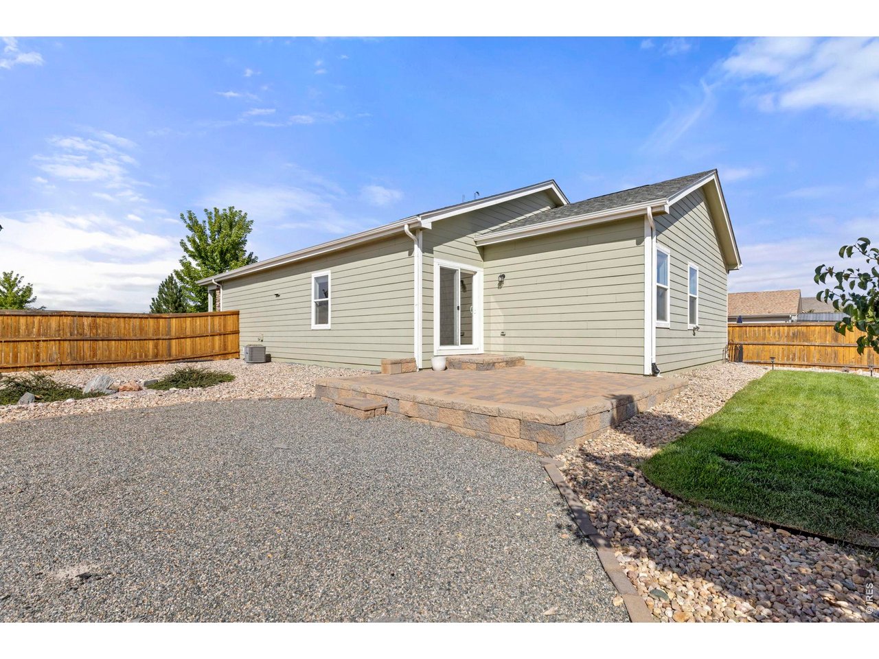 Property Photo 24 Low Maintenance Backyard with Expansive 15-ft x 15-ft Stone Patio