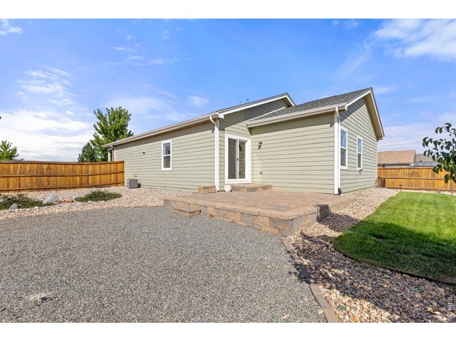 Property Photo 24 Low Maintenance Backyard with Expansive 15-ft x 15-ft Stone Patio
