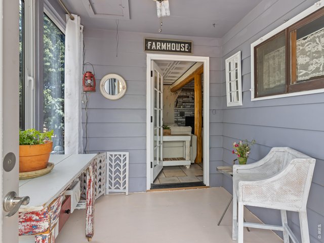 Property Photo 3 Enclosed entryway/sunroom.
