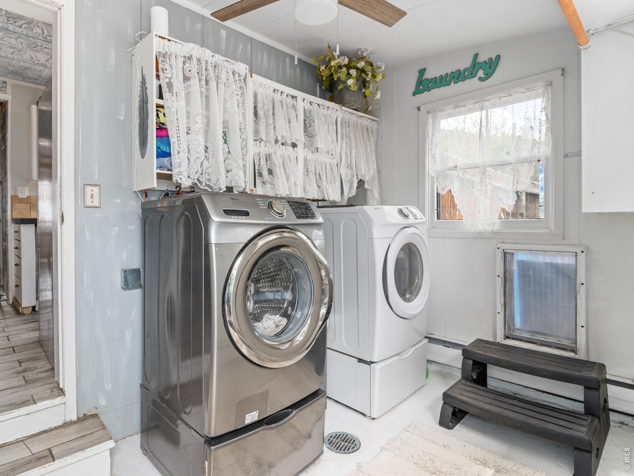 Property Photo 15 Laundry room with a dog door to the enclosed backyard.