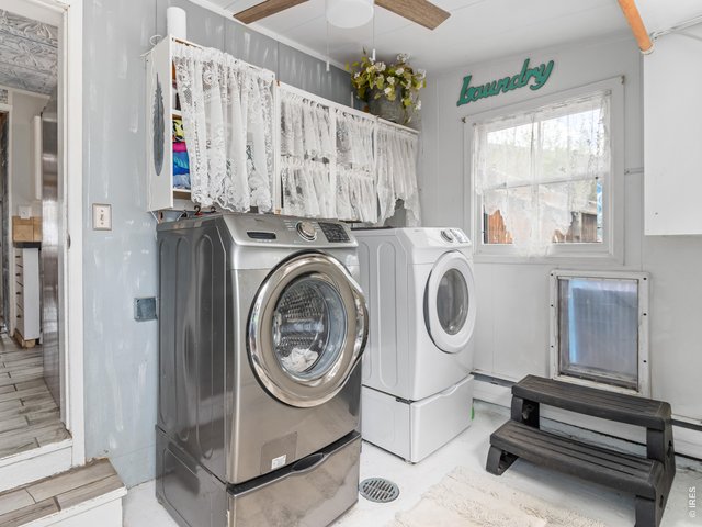 Property Photo 15 Laundry room with a dog door to the enclosed backyard.