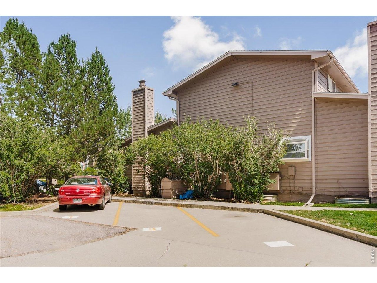 Property Photo 28 There is one deeded parking spot in the rear of the building #5, not shown here in this side pic
