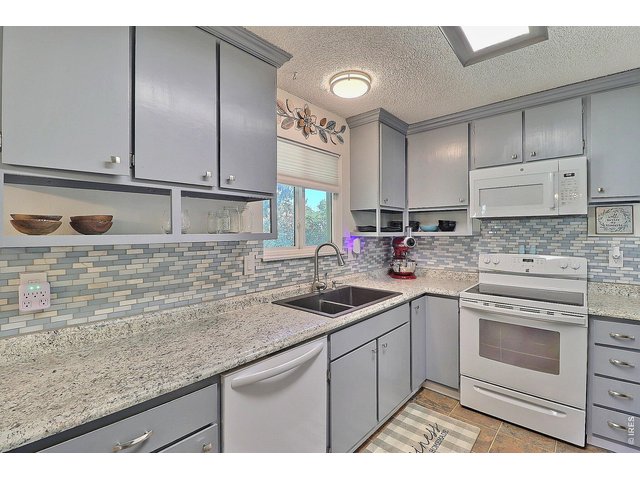 Property Photo 16 Sink Window Overlooks Backyard