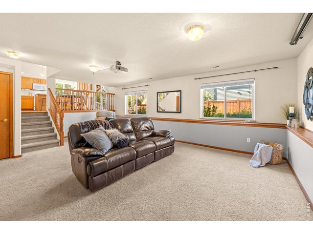 Property Photo 7 Large Living Room Area Open to Main Level