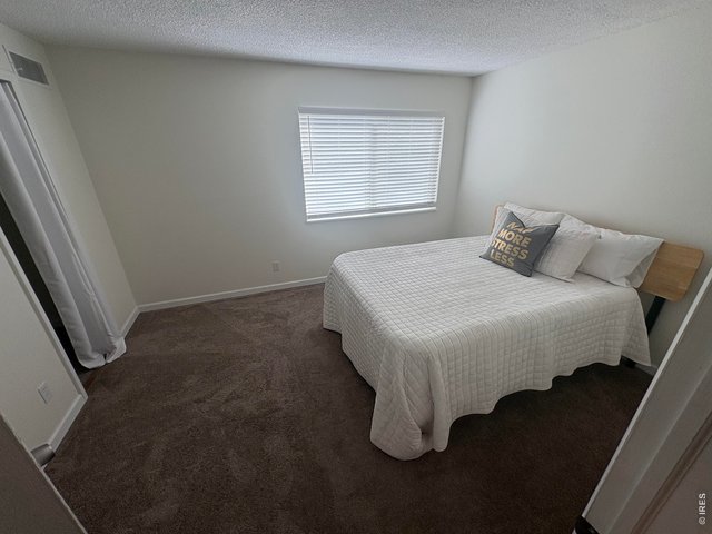 Property Photo 19 Secondary bedroom on upper level.