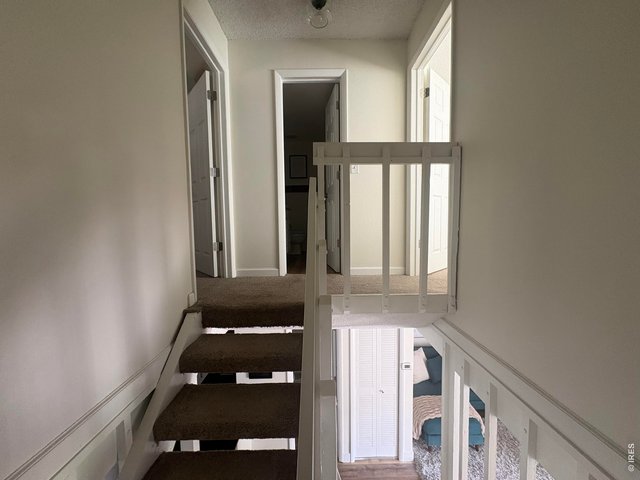 Property Photo 16 Floating stairwell to upper level.