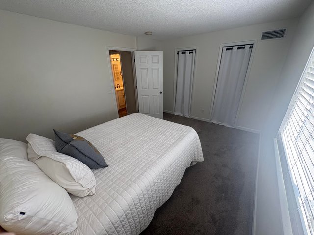 Property Photo 20 Secondary bedroom on upper level.