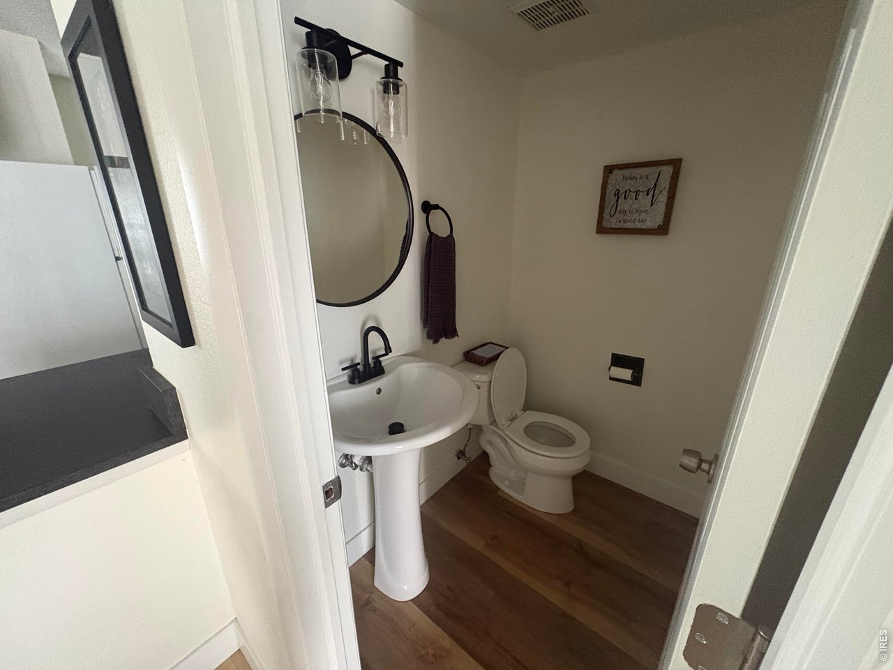 Property Photo 13 Half bathroom on main level.