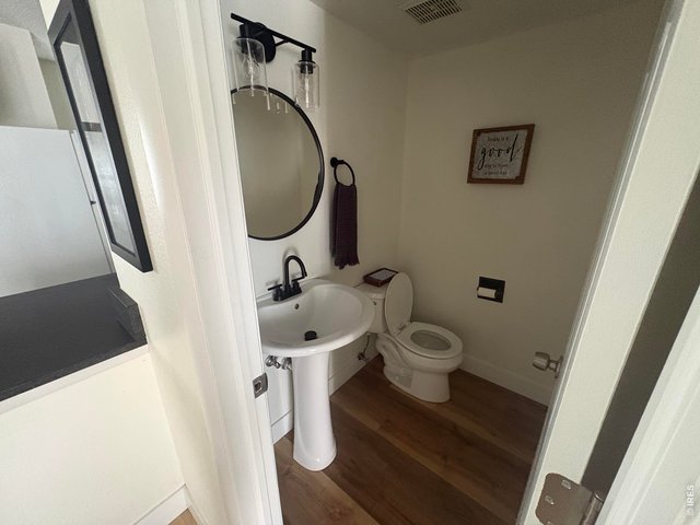 Property Photo 13 Half bathroom on main level.