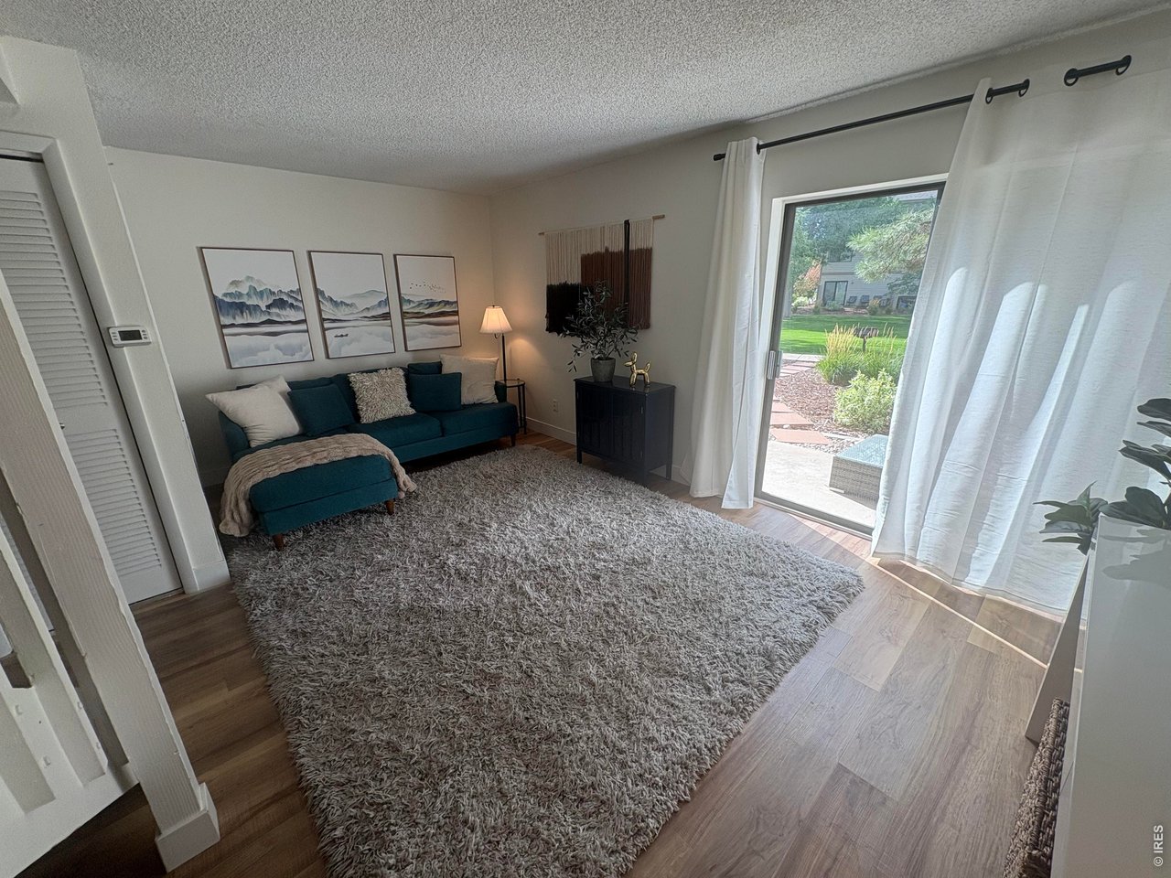 Property Photo 1 Living room opens to back patio.