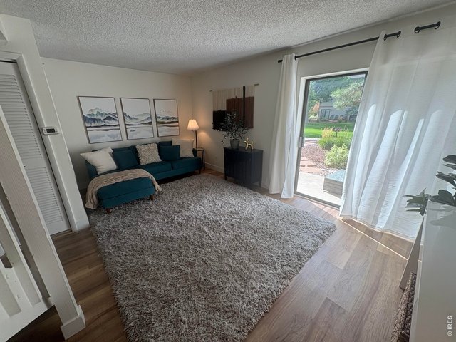 Property Photo 1 Living room opens to back patio.