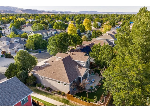 Property Photo 12 Sunny west facing orientation and exposure! Full privacy fence and massive patio! Forested feel along the backside with established landscaping all over.