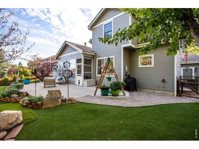 Property Photo 13 Enclosed Covered patio or Sunroom right off the east side - flexible options for your next sanctuary!