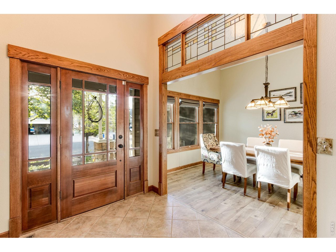 Property Photo 14 Soaring Open Ceilings in the front entry! Low maintenance tile floors, gorgeous millwork and fully cased widnows and doorway. Leaded glass transom, Pella windows.