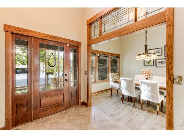 Property Photo 14 Soaring Open Ceilings in the front entry! Low maintenance tile floors, gorgeous millwork and fully cased widnows and doorway. Leaded glass transom, Pella windows.