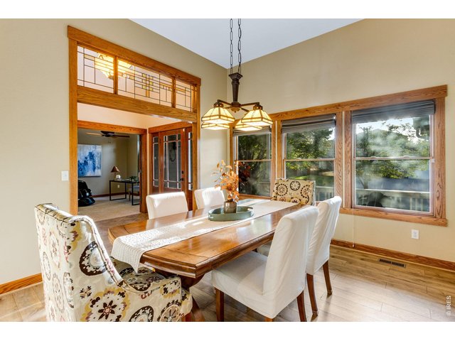 Property Photo 15 Front formal dining, Craftsman & Frank Lloyd Wright inspiration. Newer LVP floors!