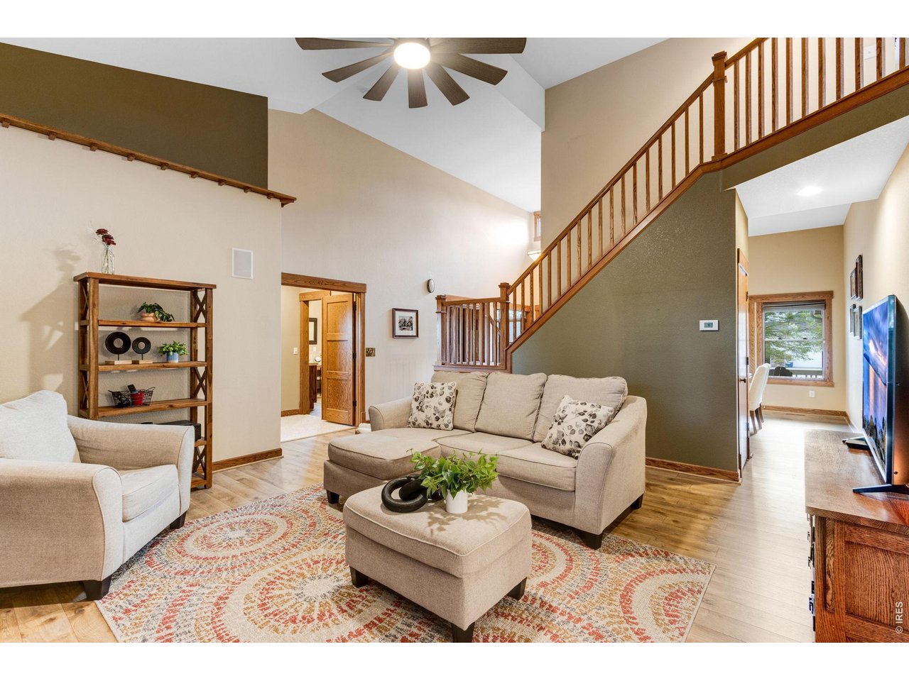 Property Photo 17 Stunning main level living area Vaulted ceilings, warm neutral interior colors, new LVP floors.