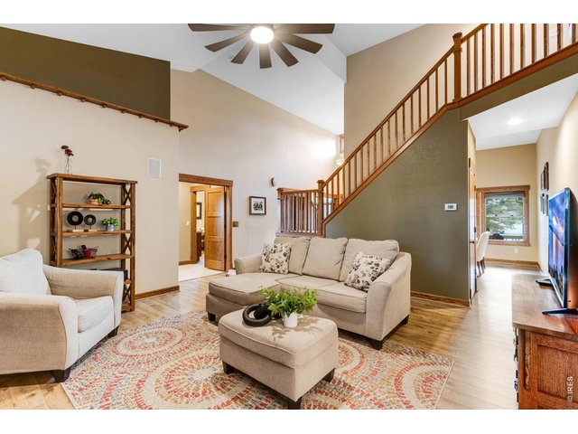 Property Photo 17 Stunning main level living area Vaulted ceilings, warm neutral interior colors, new LVP floors.