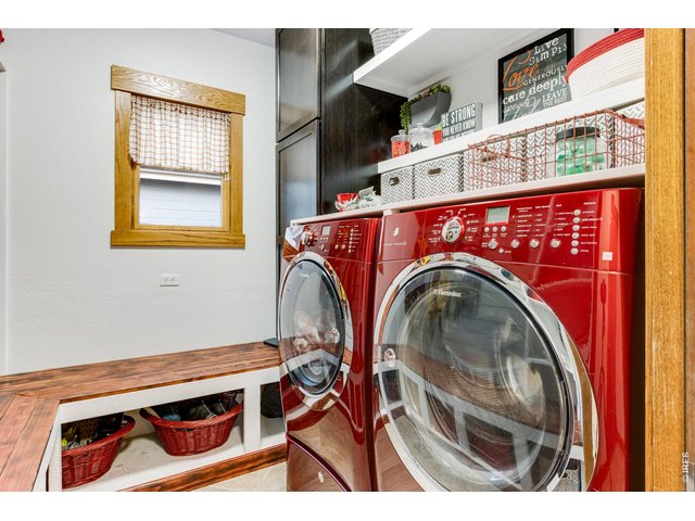 Property Photo 26 Adorable Bright Laundry Room & Mudroom conveniently located off the garage area. Shiny Red Electrolux & pedestals W/D are included! Active Radon Mitigation system installed!