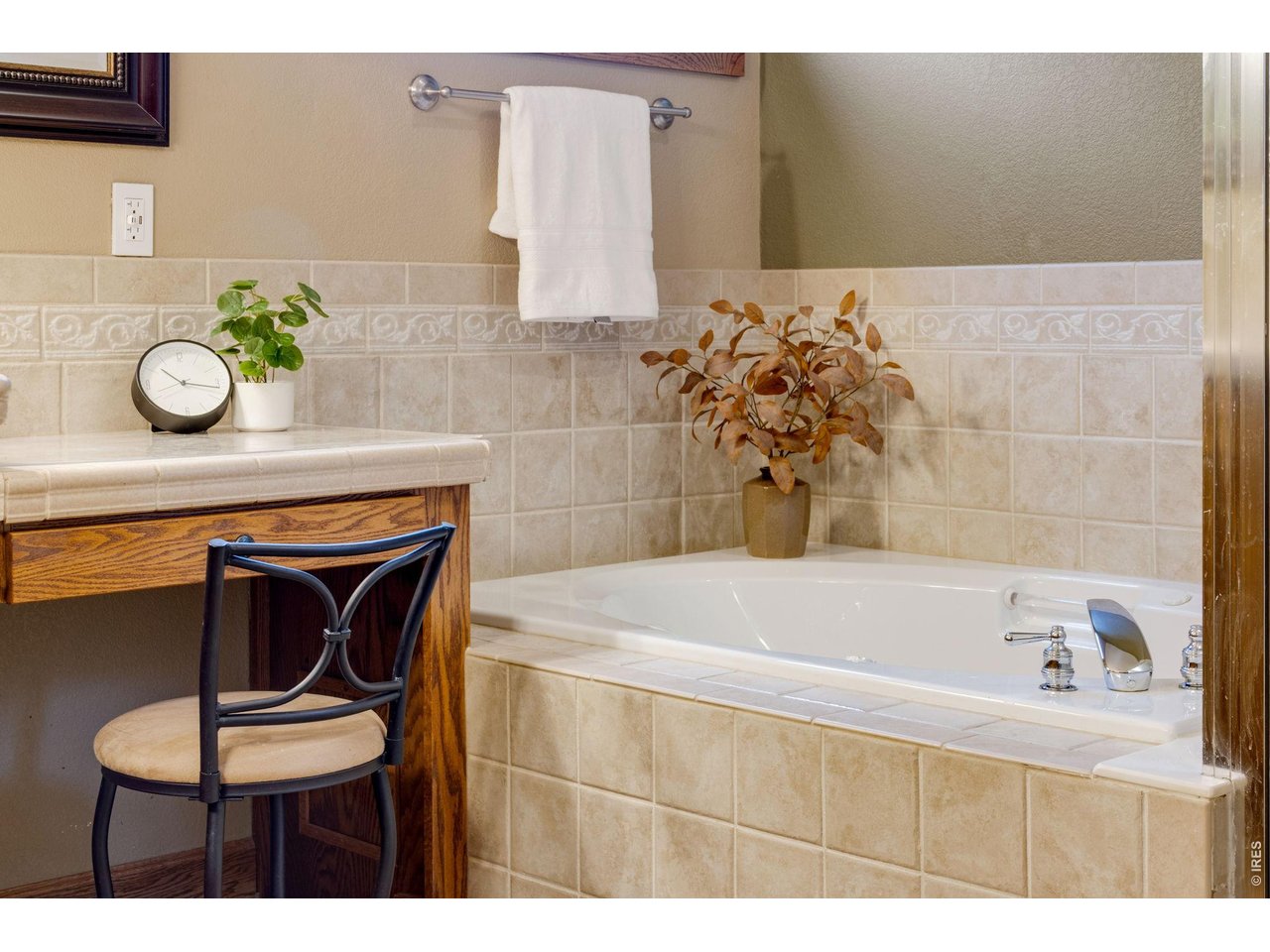 Property Photo 29 Added vanity area, elegance tile work throughout!